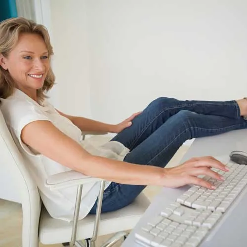 Woman looking relaxed as she has ongoing support for her website
